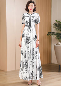Elegant monochrome floral chiffon maxi dress with puff sleeves and contrast trim, retro-modern style from Vivian Seven.