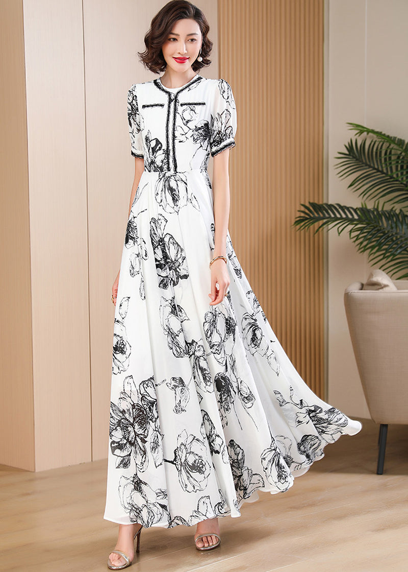 Breathable lightweight chiffon floral maxi dress in black and white, featuring a feminine flared skirt and puff short sleeves.