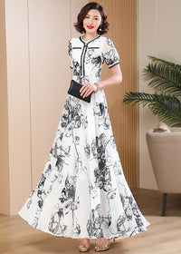 Sophisticated botanical print dress styled with a black clutch, perfect for formal evening events and garden parties.