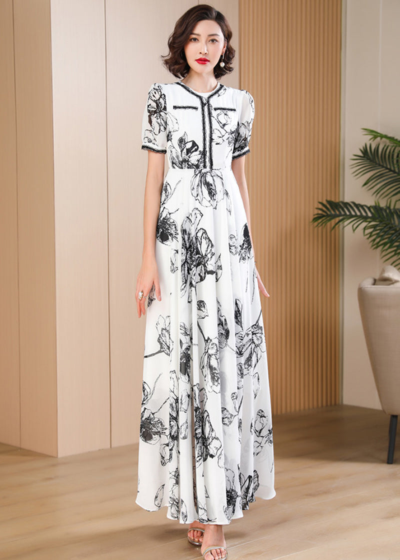 Minimalist monochrome floral print maxi dress with a round neckline and delicate lace-up bodice detailing, Vivian Seven.