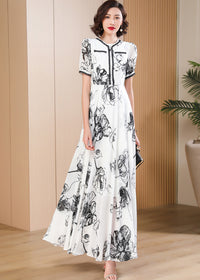 Minimalist monochrome floral print maxi dress with a round neckline and delicate lace-up bodice detailing, Vivian Seven.