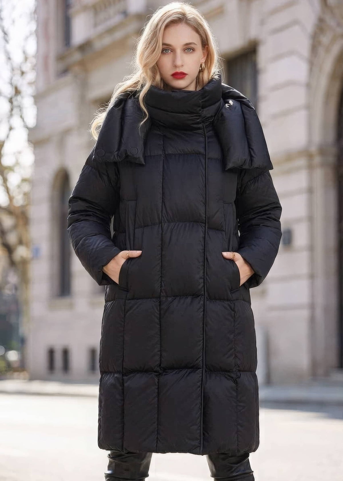 Woman with hands in pockets wearing black high neck box-quilted long down puffer coat