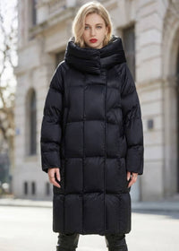 Full length front view of woman wearing black high neck quilted duck down long coat