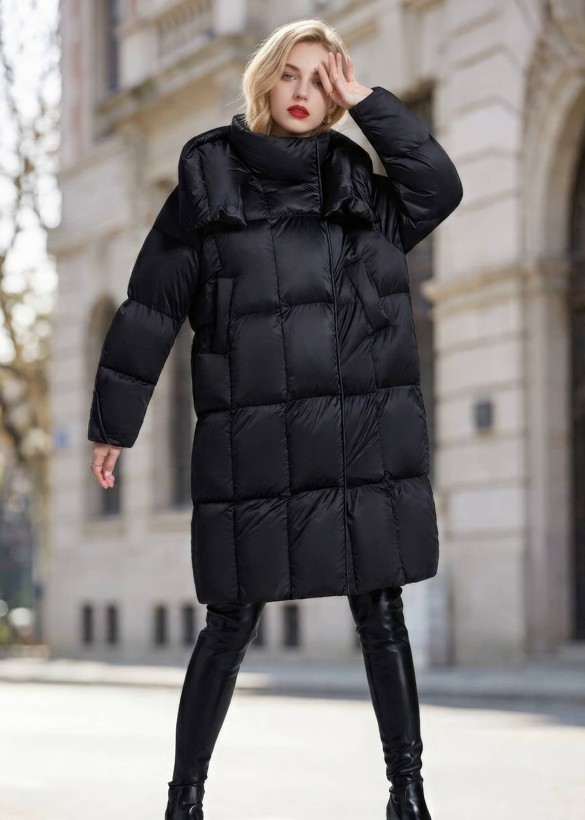 Full length fashion pose of woman wearing black high collar box-quilted down puffer coat
