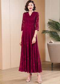 Full-length shot of sophisticated dark red floral mesh party dress for evening occasions.