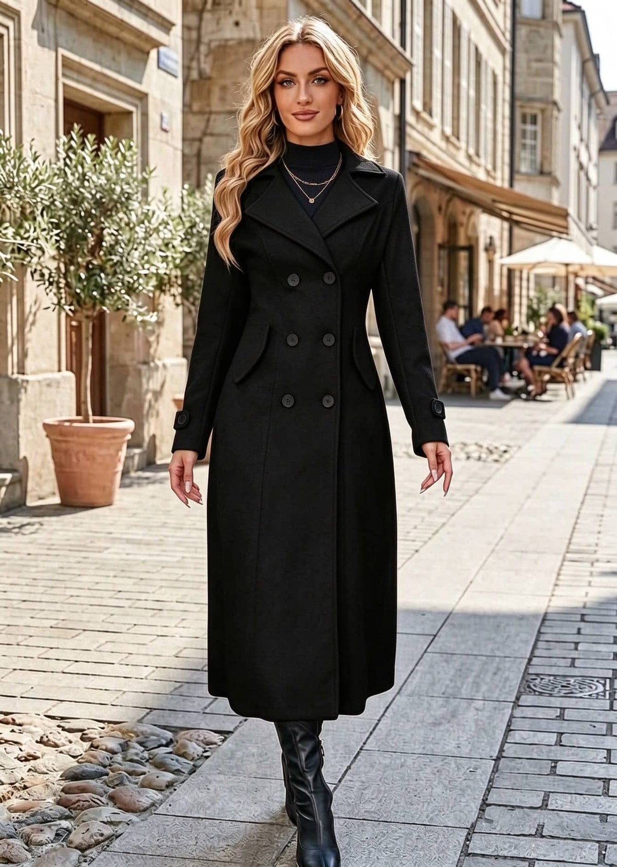 Full length front view of woman wearing elegant black classic double-breasted long overcoat with flap pockets