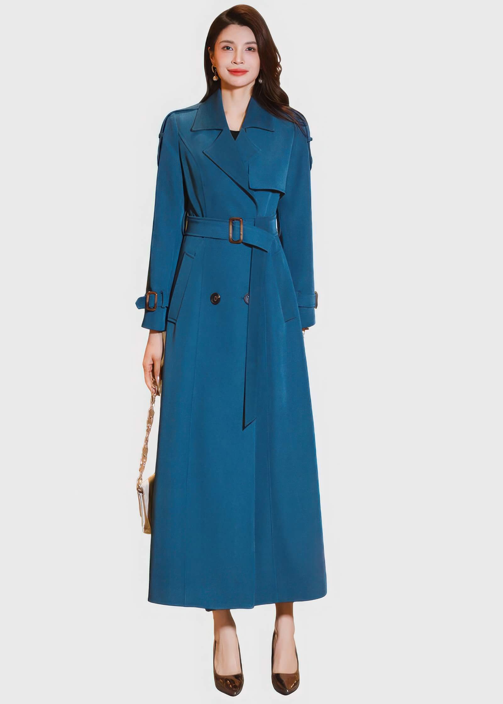 Elegant teal blue long women's trench coat with a double-breasted front, notched lapels, and an adjustable waist belt with buckle.