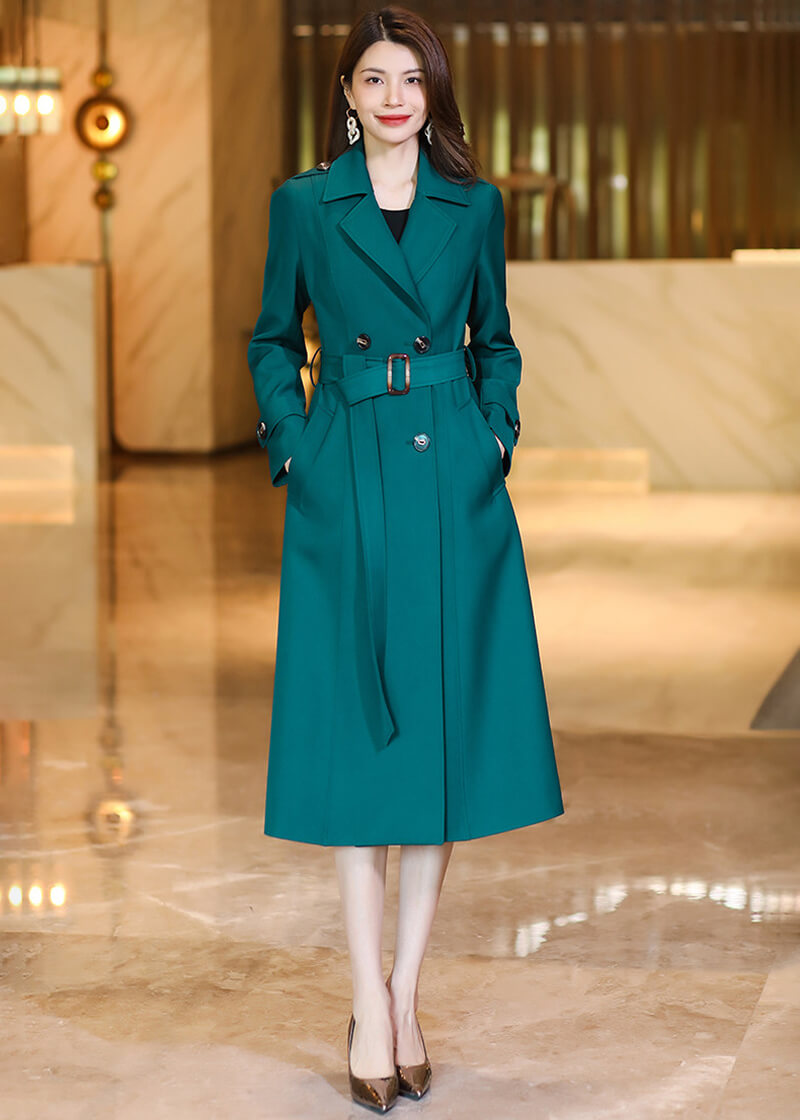 Full-length front view of the Vivian Seven dark teal long trench coat with a cinched waist.