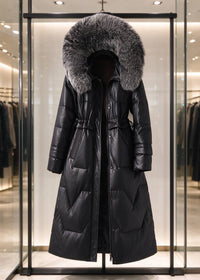 Black genuine sheepskin leather down coat with dark fluffy fox fur trim hood displayed on showroom rack