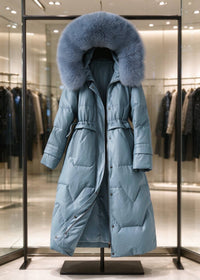 Dusty blue genuine sheepskin leather down long coat with matching fox fur hood on hanger in store display