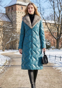 Full length front view of woman wearing teal blue quilted genuine sheepskin leather down coat with mink fur shawl collar