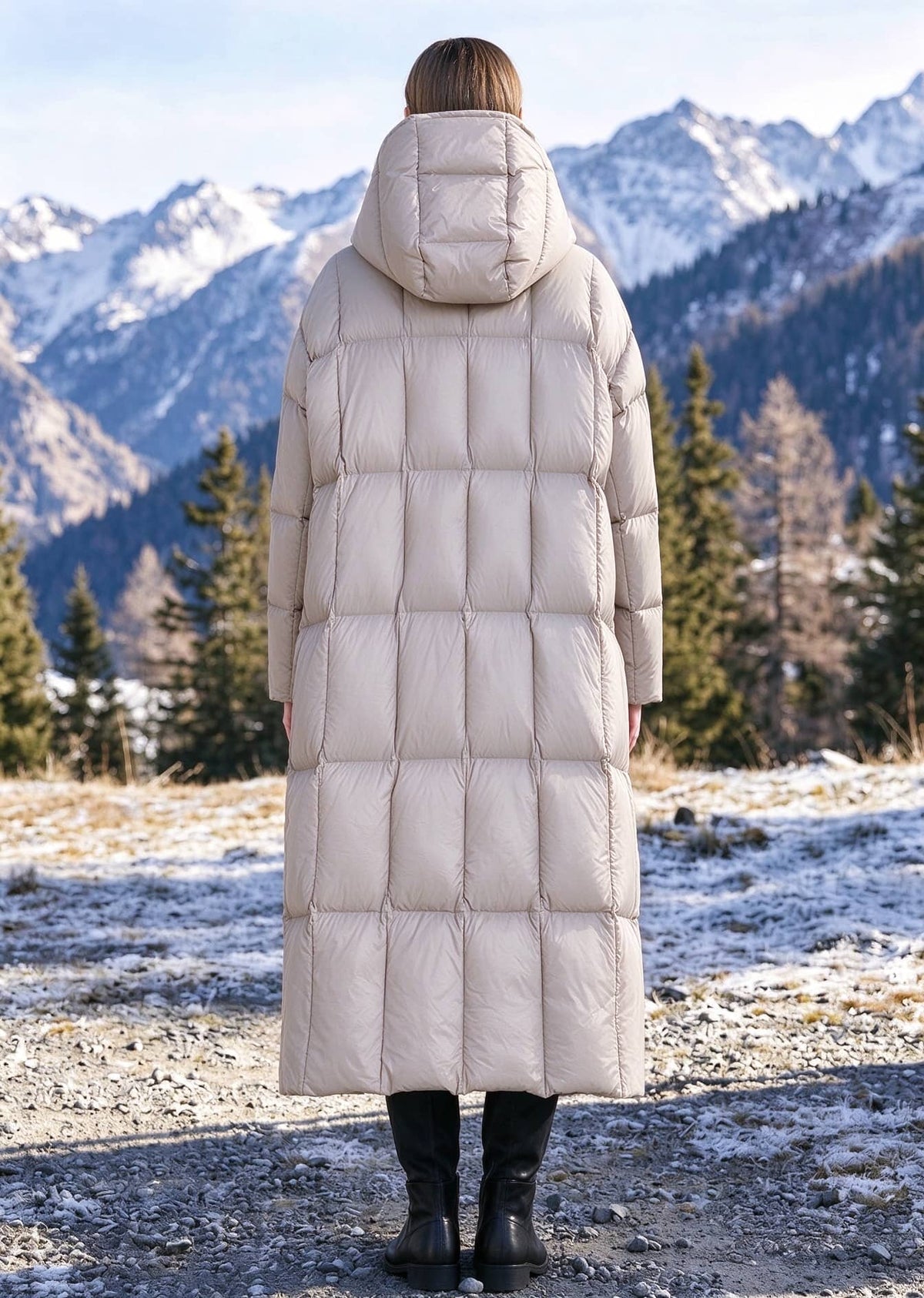 Back view of woman wearing beige quilted longline hooded down parka coat