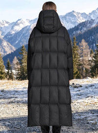 Back view of woman wearing black longline hooded down parka coat