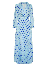 A product shot of a light blue long-sleeved midi dress on a white background, viewed from the front. The dress features a dark blue polka-dot pattern, a notched lapel collar, a wrap-style bodice, and a pleated, flowy skirt.