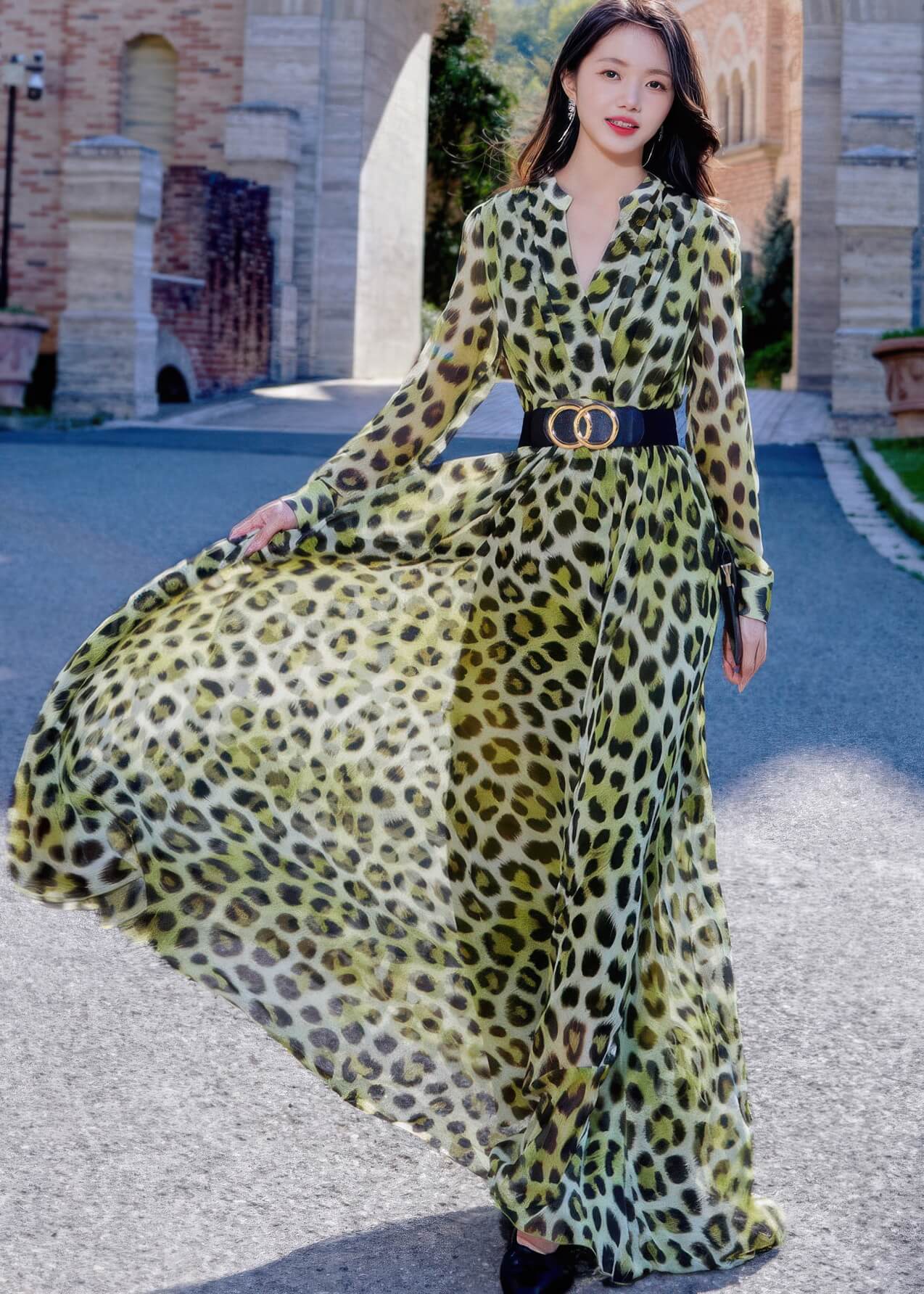 Front view of the leopard print long-sleeve maxi dress, featuring a flattering V-neckline and a black statement belt with gold double-ring hardware.