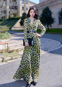 Sophisticated styling of the leopard print maxi dress paired with a black clutch bag and pointed heels, perfect for formal party or evening wear inspiration.
