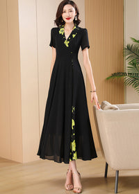 Standing Pose,Sophisticated black maxi dress for women featuring a wrap-style V-neckline and vibrant yellow-green floral accents.