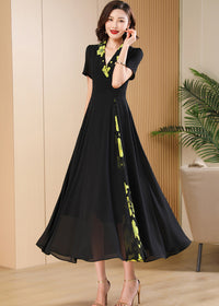 Elegant Portrait,Elegant portrait of a woman wearing the Vivian Seven black and green floral accent dress with gold high heels.