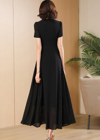 Back View,Back view of the Vivian Seven black maxi dress featuring a high-waisted A-line silhouette and short sleeves.
