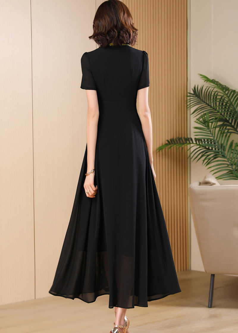 Back View,Back view of the Vivian Seven black maxi dress featuring a high-waisted A-line silhouette and short sleeves.