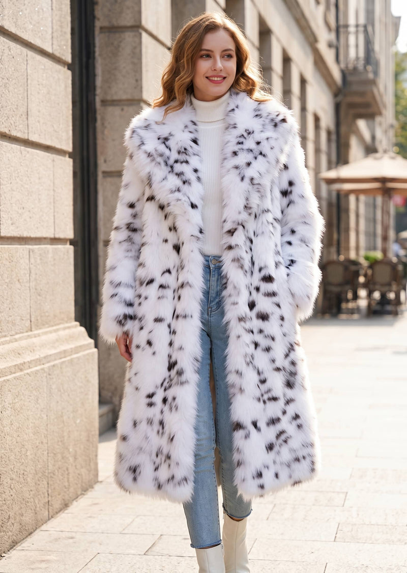 Front-facing street style portrait of a woman modeling an open snow leopard print faux fur maxi coat with an oversized shawl collar.  