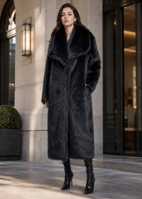Side view of model walking in a Vivian Seven longline black faux fur coat with hands in pockets and high-heeled boots