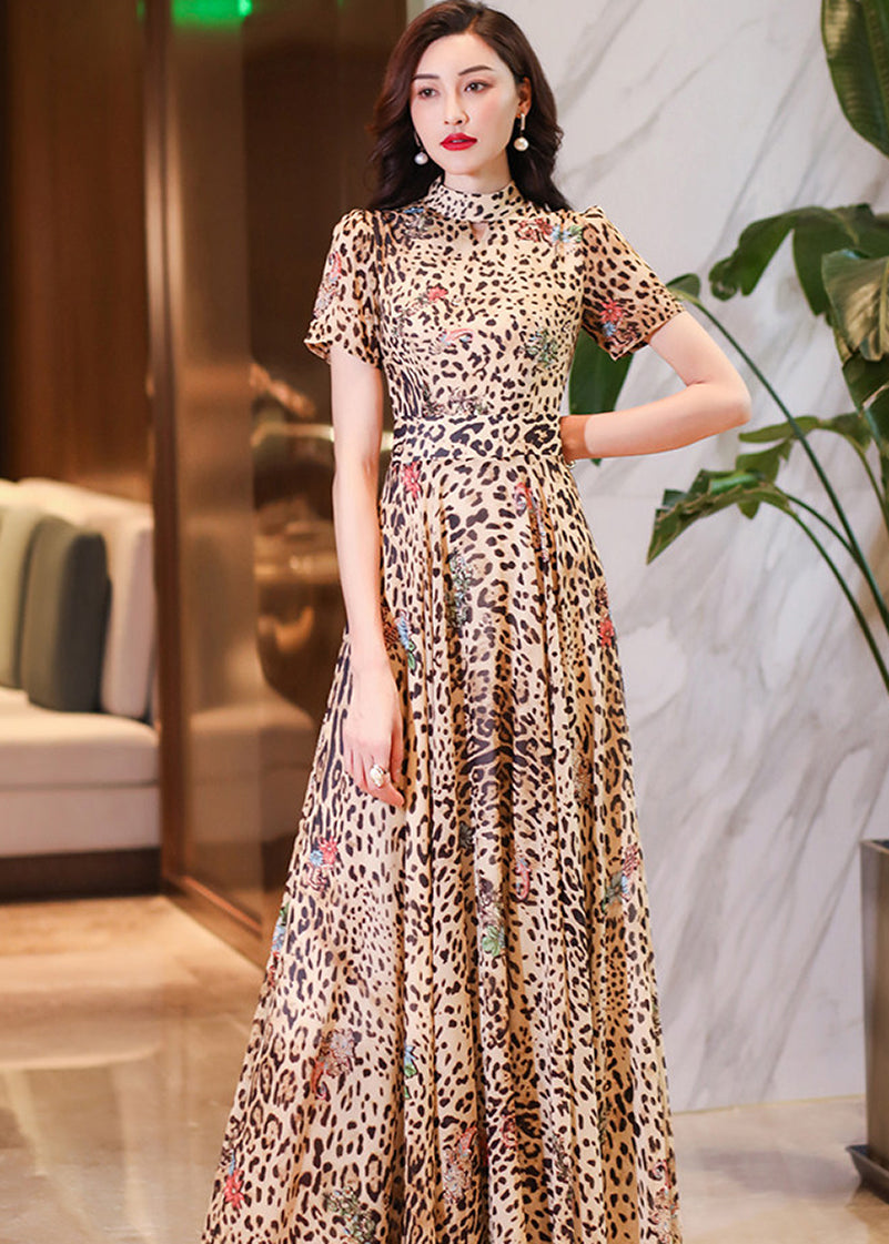 High-neck leopard print maxi dress with colorful floral embroidery details for a sophisticated look.