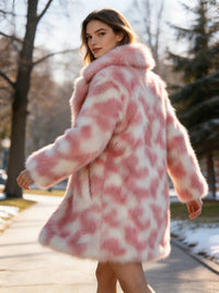 Dynamic back view of a woman turning in a park while wearing a plush blush pink and white faux fur coat.