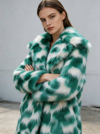Model crossing arms wearing a women's emerald green and white patterned plush faux fur coat.