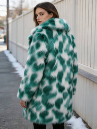 Back view showing the pattern and texture of a women's emerald green patterned faux fur coat.