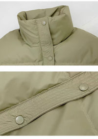 Close-up of a green jacket with buttons on a white background