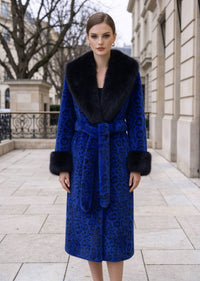 Front view of woman wearing royal blue leopard print long faux fur coat with black fur collar and cuffs