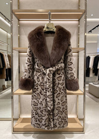 Classic brown leopard print long faux fur coat with plush collar hanging on display rack