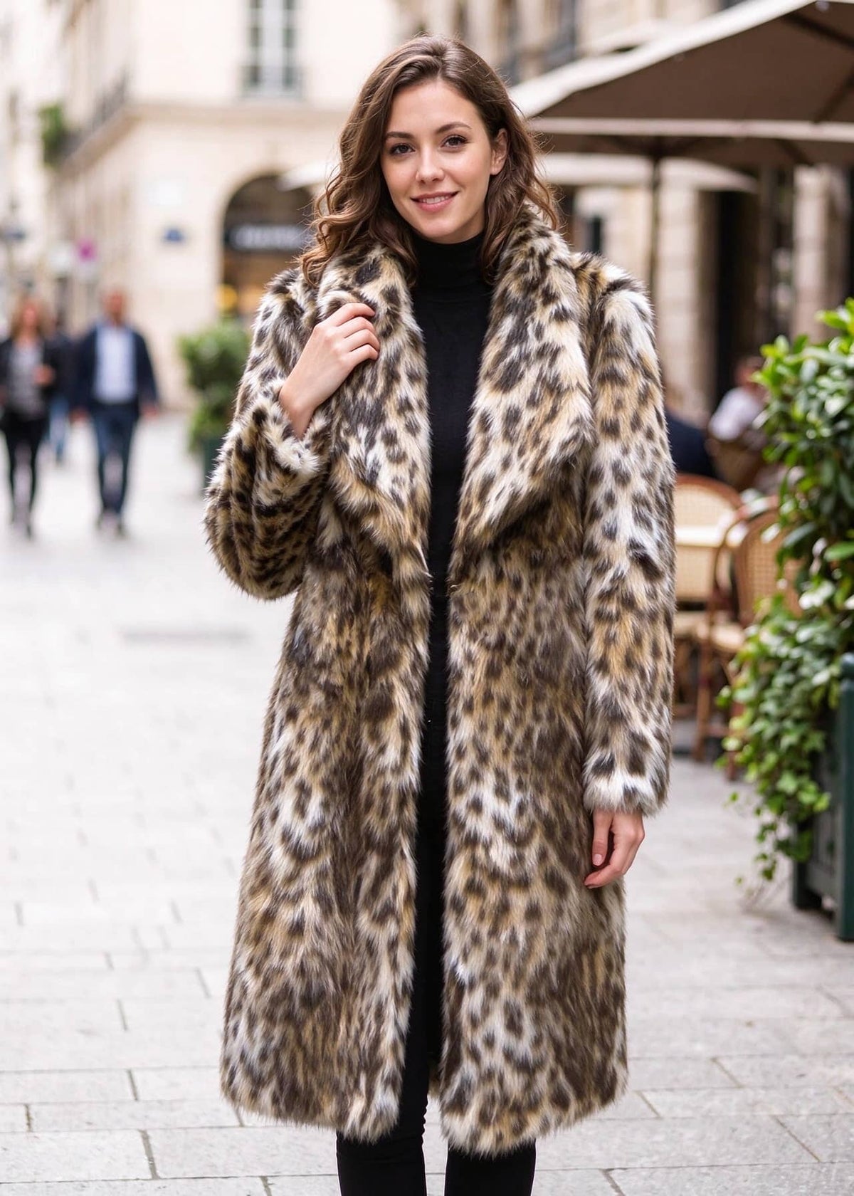 Front-facing full-length view of an elegant woman wearing a leopard print faux fur midi coat over a black turtleneck.  
