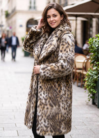 Side-angle street view showcasing the relaxed silhouette and textured leopard print faux fur of the midi-length coat.  