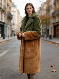 Three-quarter front view of a woman posing outdoors in an olive green and rust plush longline faux fur coat.
