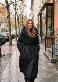 Full-length front view of Vivian Seven black hooded wrap down puffer coat with self-tie belt