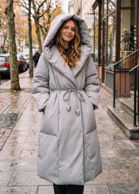 Front view of Vivian Seven women's light gray long hooded wrap down puffer coat with belt