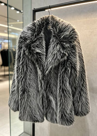 Front product shot of the Vivian Seven women's salt-and-pepper grey faux fur coat with a spread collar hanging on a clothing rack.