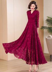 Dynamic shot of Vivian Seven burgundy swing dress with a wide-flared skirt and floral textures.