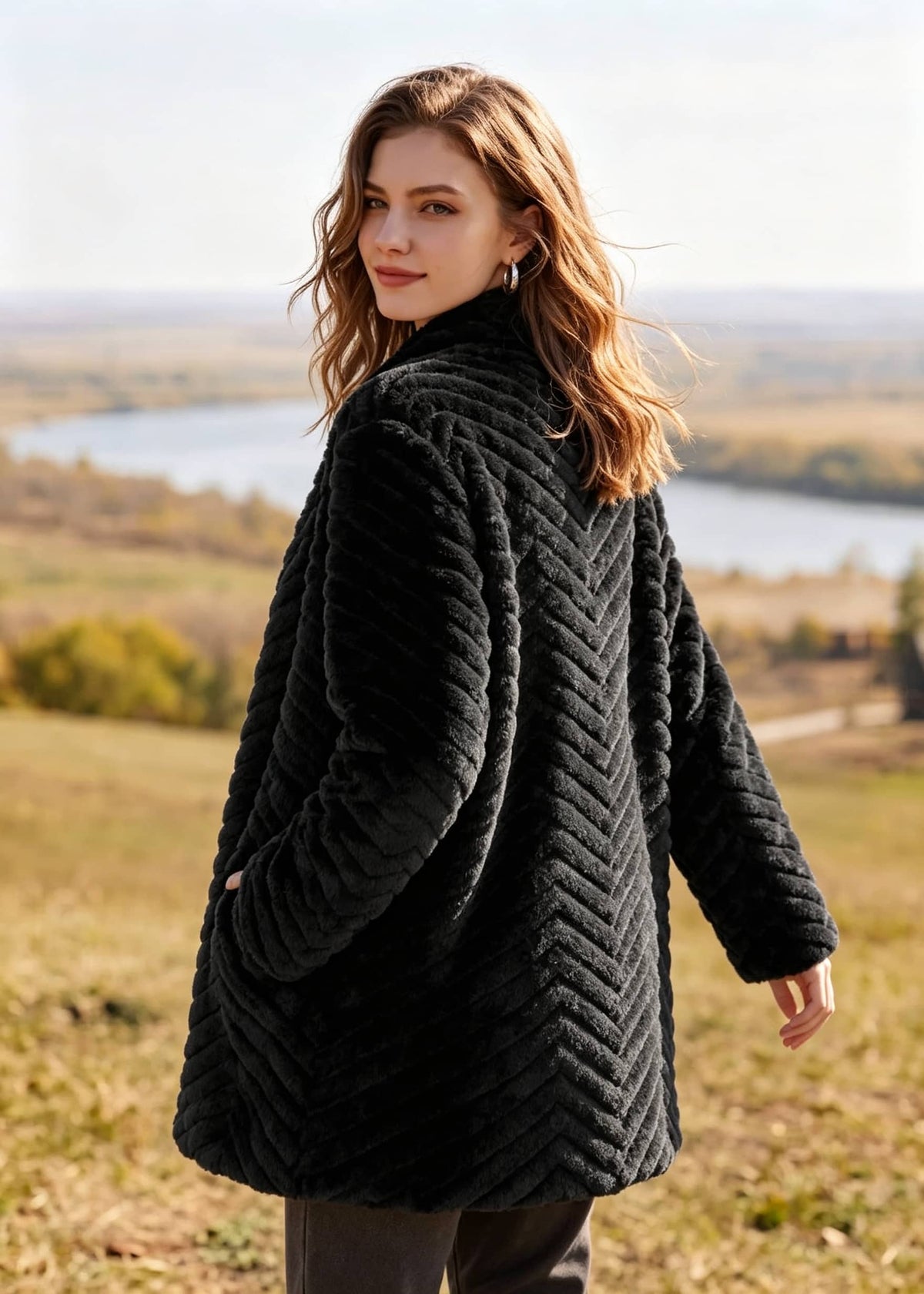 Back and side view of woman showcasing chevron textured black faux fur coat outdoors