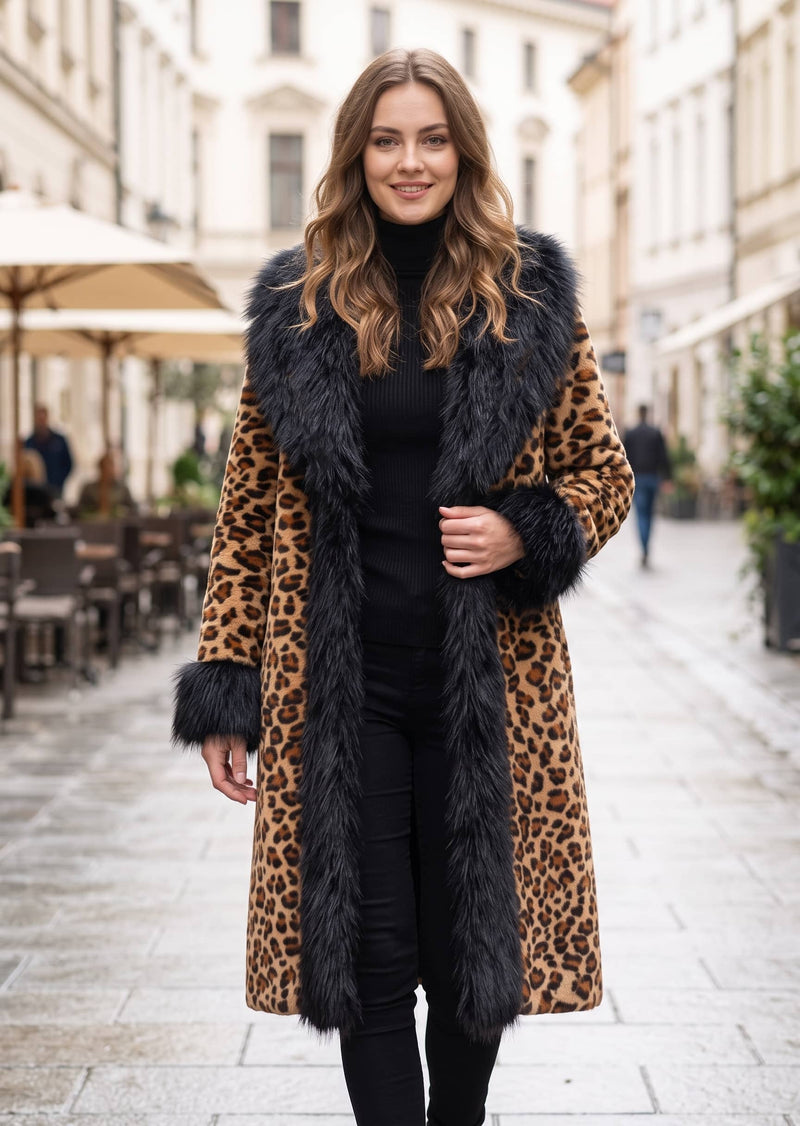 Three-quarter front look of a woman outdoors wearing a statement leopard print faux fur coat with black plush fur trim.   