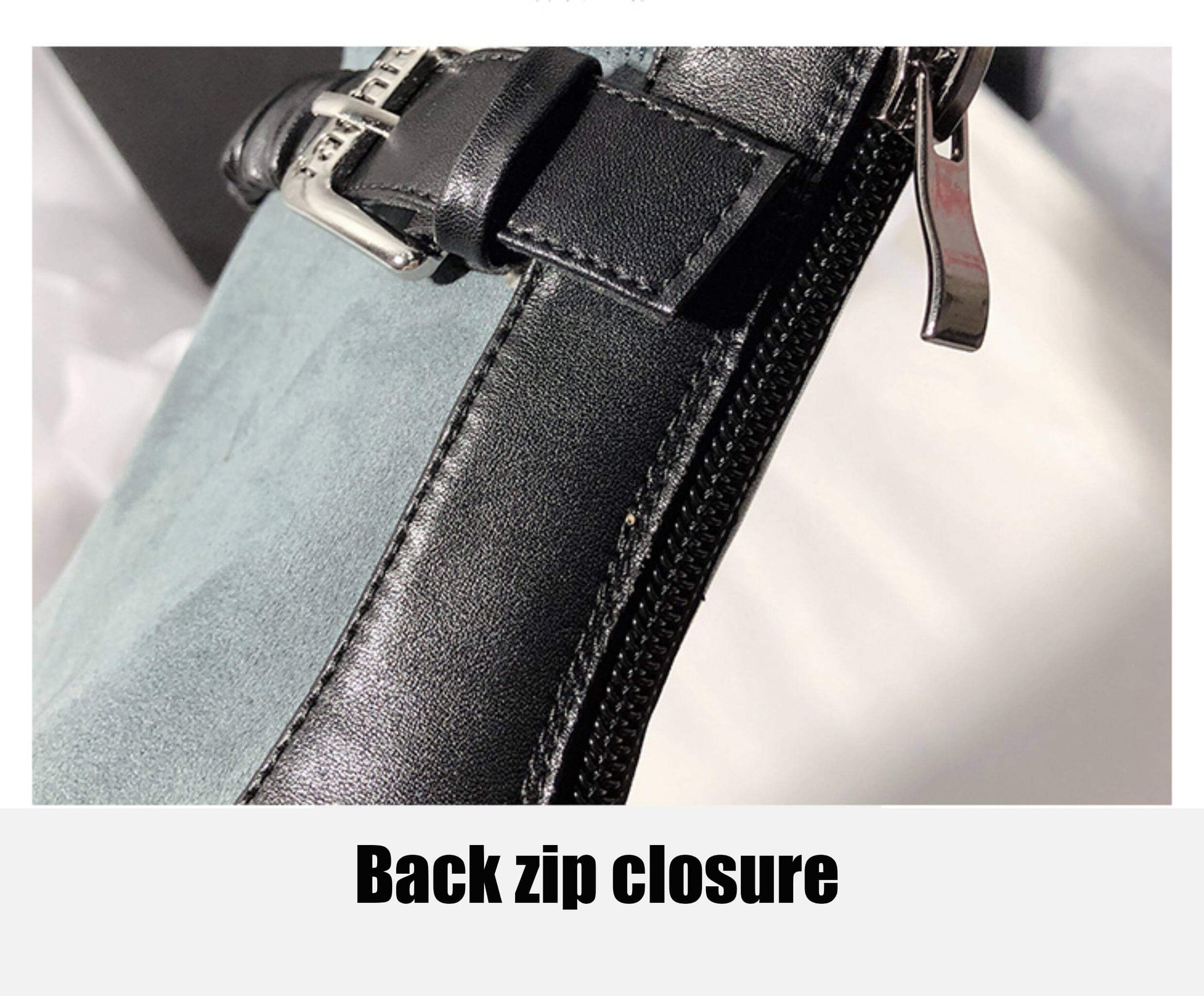 A detailed close-up of the "Back zip closure" on the boot, showing the black leather trim and the metallic zipper pull.
