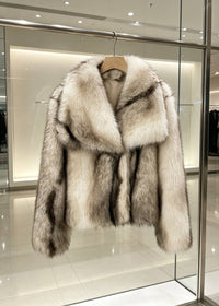 Cream white fluffy faux fur short coat with wide sailor collar hanging on clothing rack