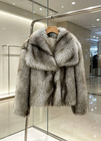 Heather gray warm cropped faux fur jacket displayed on wooden hanger